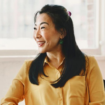 Woman in office smiling at desk
